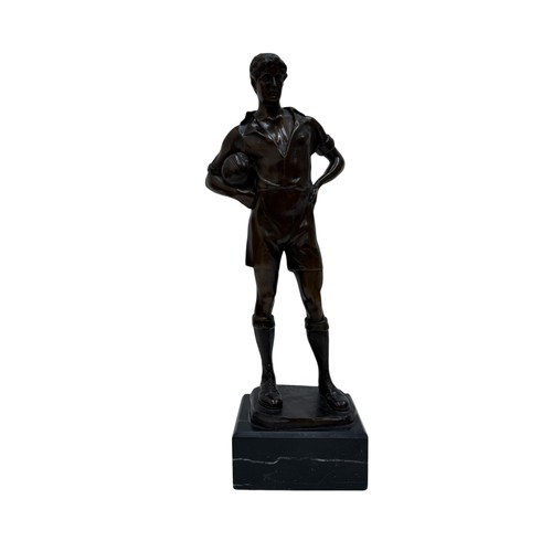 327 - A GERMAN BRONZE FIGURE OF A FOOTBALLER, CAST FROM A MODEL BY RUDOLF MARCUSE, THE FIGURE SHOWN STANDI... 