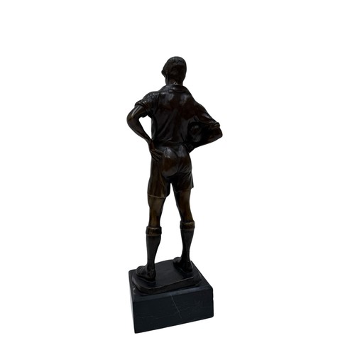 327 - A GERMAN BRONZE FIGURE OF A FOOTBALLER, CAST FROM A MODEL BY RUDOLF MARCUSE, THE FIGURE SHOWN STANDI... 