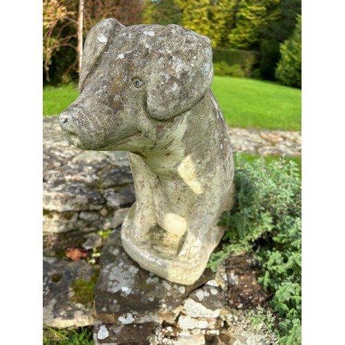 61 - A PAIR OF RECUMBENT STONE PIGS, reconstituted stone.
54cm and 45cm in height