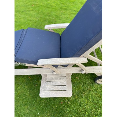 66 - A PAIR OF INDIAN OCEAN SUN LOUNGERS, with Indian Ocean blue upholstered cushions.
All labelled.