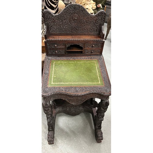90 - AN ANGLO INDIAN BOMBAY WOOD DAVENPORT circa 1830.

Fitted with campaign drawers to one side and a ri...