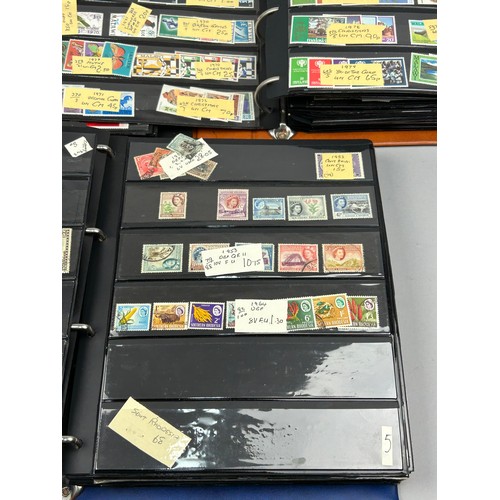 156 - A COLLECTION OF SIX WORLD STAMP ALBUMS, with material from The Seychelles, South Africa, New Zealand... 