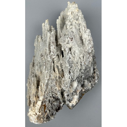 21 - A LARGE STALACTITIC QUARTZ MINERAL ON STAND,

65cm x 35cm including base