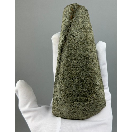 39 - A NEOLITHIC AXE HEAD FROM SUFFOLK 

15cm x 7cm