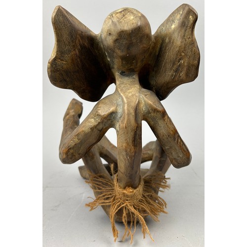 198 - AN EARLY TRIBAL WOODEN FIGURE OF AN ELEPHANT, 

33cm x 25cm