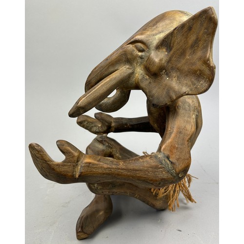 198 - AN EARLY TRIBAL WOODEN FIGURE OF AN ELEPHANT, 

33cm x 25cm