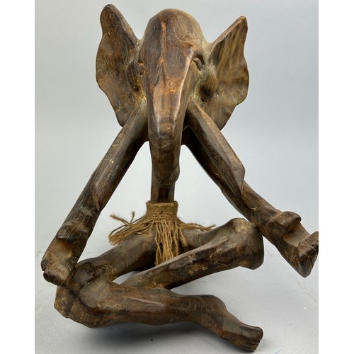 198 - AN EARLY TRIBAL WOODEN FIGURE OF AN ELEPHANT, 

33cm x 25cm