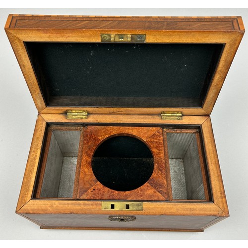 189 - A GOOD REGENCY SHERATON DESIGN TEA CADDY, with rising lid veneered in figured mahogany. The interior... 