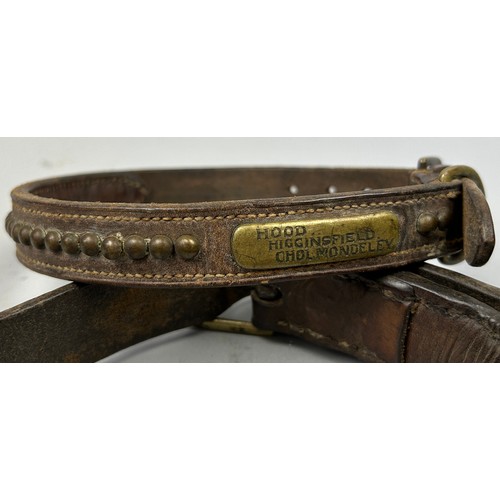 49 - A SET OF TWO LEATHER COLLARS WITH BRASS STUDS AND NAME PLATES, one inscribed.