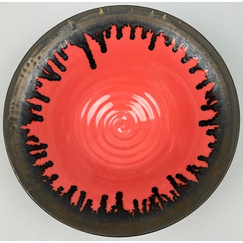 168 - A STUDIO POTTERY CERAMIC VERMILLION GLAZED BOWL WITH BRONZED RIM, in the manner of Lucie Rie.

25.5c... 