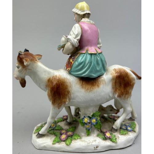 172 - A CHELSEA PORCELAIN CERAMIC GROUP OF A LADY WITH A GOAT, with gold anchor mark.