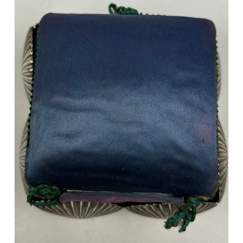 156 - A SILVER SCALLOP SHELL JEWELLERY BOX, with purple cushion and green silk lining. 

Numbered 71387 to... 