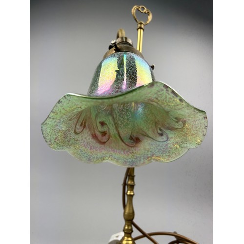 112 - A LAMP BY CHRISTOPHER WRAY, irridescent art glass on brass stem and base.

56cm in height