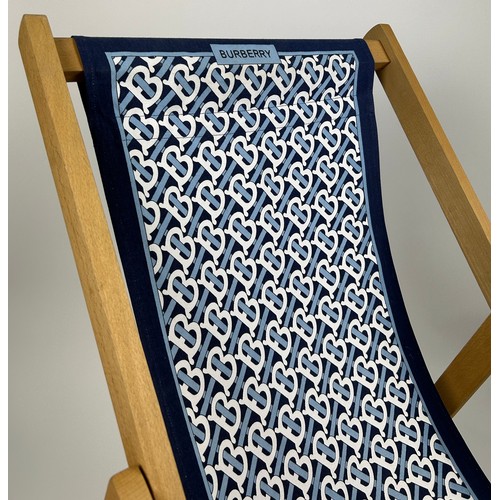 150 - A BURBERRY RECLINING DECK CHAIR, with blue and white interlocking 'B' monogram.

104cm x 104cm