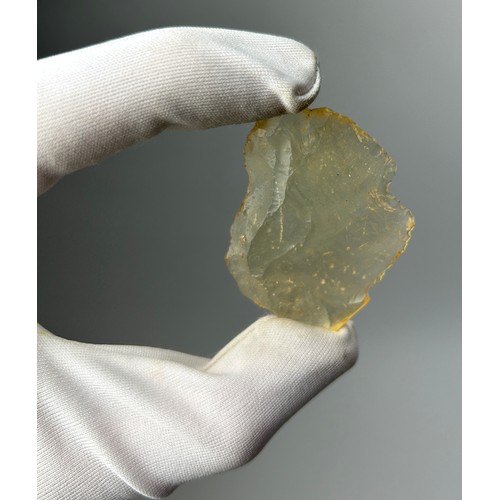 25 - A NEOLITHIC SCRAPING TOOL IN DESERT GLASS TEKTITE, 

From the Tenerean Culture, tool was worked circ... 