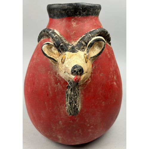 175 - A PRE-COLUMBIAN STYLE JUG, modern after the antique with vivid red earthenware glaze and figure of a... 