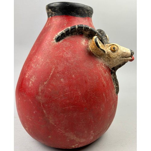 175 - A PRE-COLUMBIAN STYLE JUG, modern after the antique with vivid red earthenware glaze and figure of a... 