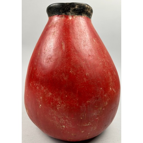 175 - A PRE-COLUMBIAN STYLE JUG, modern after the antique with vivid red earthenware glaze and figure of a... 