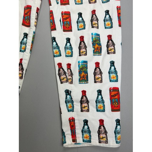 138 - A RARE PAIR OF 1980'S VERSACE POP ART ANDY WARHOL MANNER LADIES 'BOTTLE' TROUSERS


28' x 28'