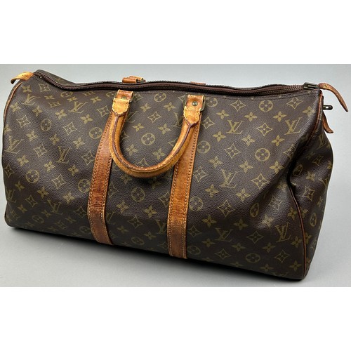 129 - A LOUIS VUITTON HOLDALL BAG

50cm x 30cm x 23cm