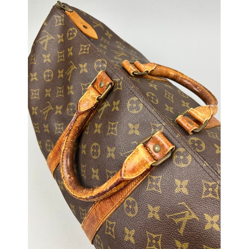 129 - A LOUIS VUITTON HOLDALL BAG

50cm x 30cm x 23cm