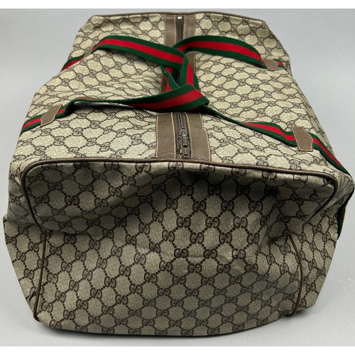 131 - A LARGE GUCCI HOLDALL BAG

45cm x 33cm x 23cm