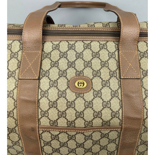 130 - A GUCCI MONOGRAM HOLDALL BAG

56cm x 28cm x 26cm