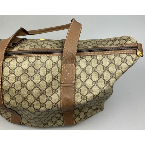 130 - A GUCCI MONOGRAM HOLDALL BAG

56cm x 28cm x 26cm