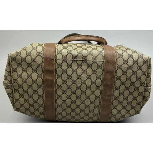 130 - A GUCCI MONOGRAM HOLDALL BAG

56cm x 28cm x 26cm