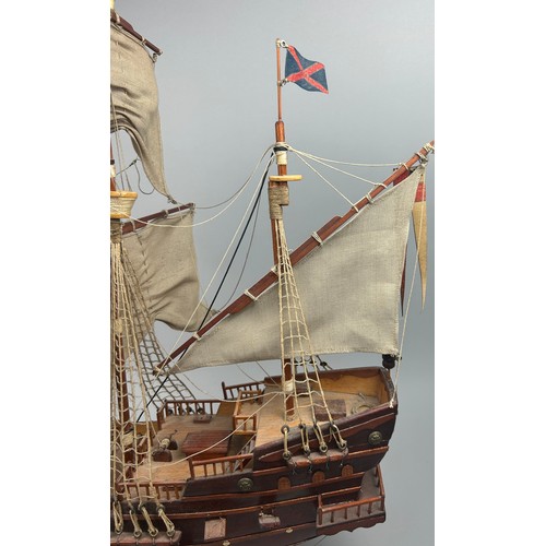 197 - A LARGE WOODEN MODEL OF A SHIP