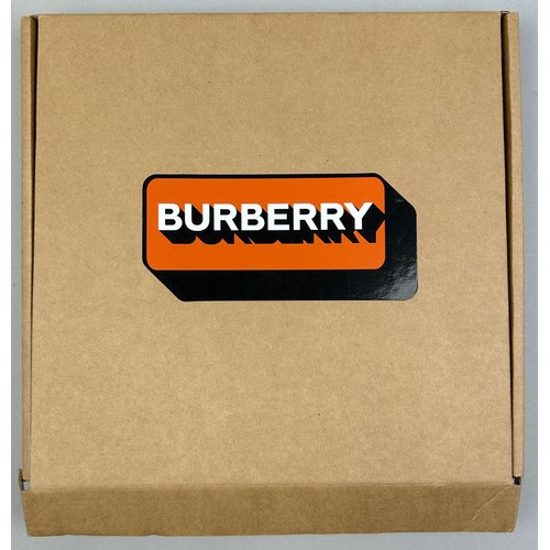 148 - AN ORANGE BURBERRY FRISBEE, unused in original box.