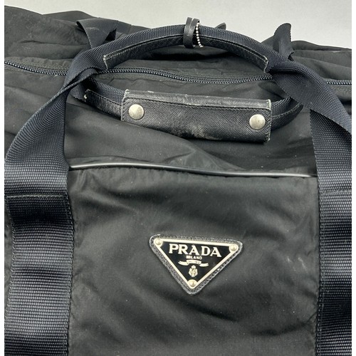 132 - A LARGE PRADA HOLDALL

78cm x 30cm x 36cm