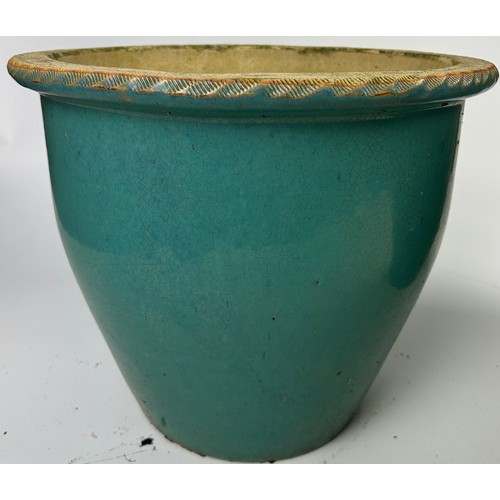 204 - TWO LARGE TURQUOISE GARDEN PLANTERS

Height: 40cm and 32cm