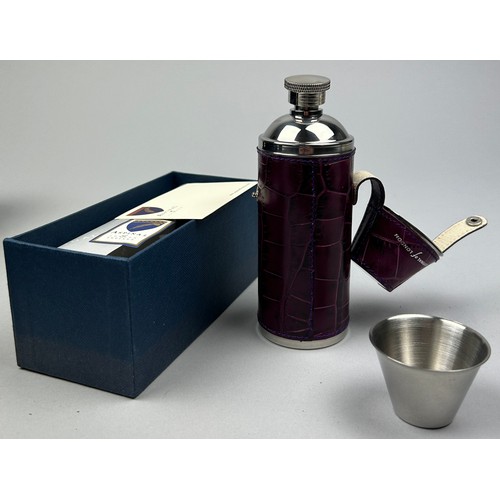 152 - AN ASPINAL OF LONDON PURPLE LEATHER AND STEEL WHISKEY FLASK, in original box.