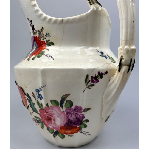 186 - A LARGE FLORAL CERAMIC JUG