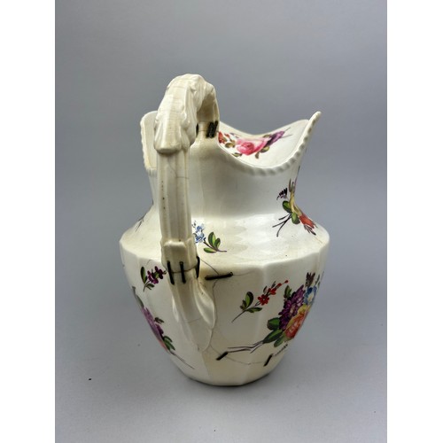 186 - A LARGE FLORAL CERAMIC JUG