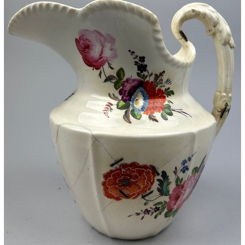 186 - A LARGE FLORAL CERAMIC JUG