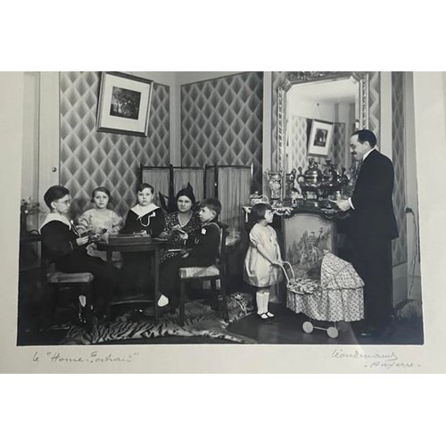 39 - A LARGE TAXIDERMY TIGER SKIN RUG CIRCA 1930, photo of rug beneath the family dinner table. Photo not... 