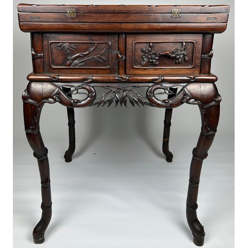 122 - A CHINESE CARVED CENTRE TABLE WITH FAUX BAMBOO CRESTS, on cabriole legs. 

Previously would have had...