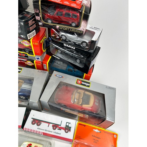 228 - A COLLECTION OF BOXED TOY CARS AND TRUCKS, some die cast to include Burago, New Ray, Eddie Stobart a... 