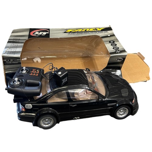 235 - TWO RADIO CONTROLLED CARS, one 1:4 very large GK Racer, the other 1:8 HT model car. 

Both with remo... 