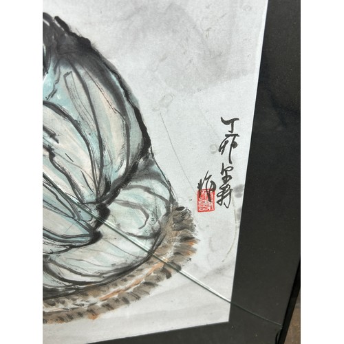 A CHINESE PASTEL AND CHARCOAL ON PAPER OF A MAN CROUCHING BESIDE A