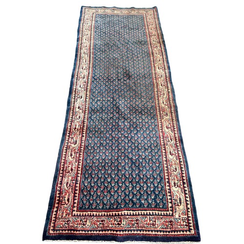 200 - A LARGE PERSIAN RUNNER CARPET