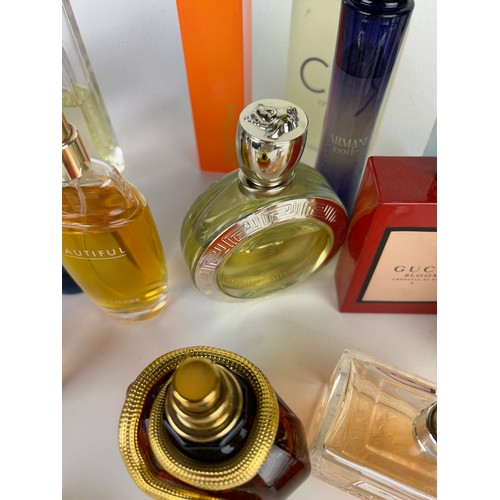 157 - A COLLECTION OF PARTIALLY USED DESIGNER PERFUME BOTTLES, to include Gucci, Versace, Guerlain and mor... 