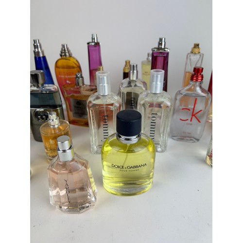 160 - A COLLECTION OF PARTIALLY USED DESIGNER PERFUME BOTTLES, to include Dolce and Gabbana, Gucci, Tommy ... 