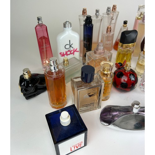 177 - A COLLECTION OF PARTIALLY USED DESIGNER PERFUME BOTTLES, to include Lacoste, Calvin Klein and more (... 