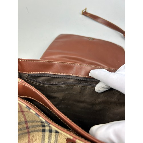 36 - A LOUIS VUITTON CROSSBODY BAG AND A BURBERRY HANDBAG

Both straps broken off the bag, zips working f... 