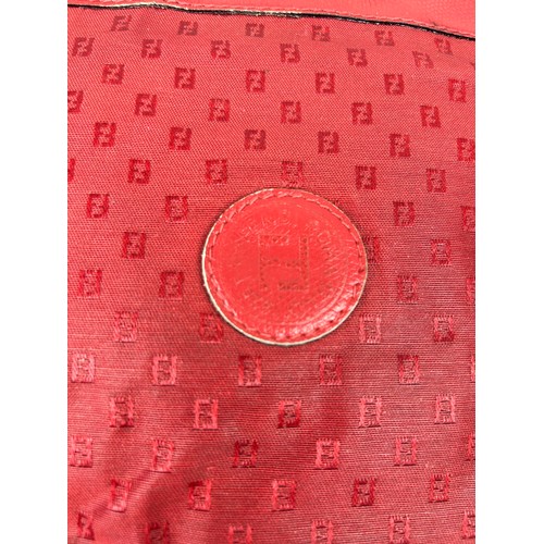 12 - A VINTAGE FENDI SIDE BAG IN BLOOD RED, interlocking 'FF' emblems throughout with a central circular ... 