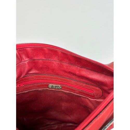 12 - A VINTAGE FENDI SIDE BAG IN BLOOD RED, interlocking 'FF' emblems throughout with a central circular ... 