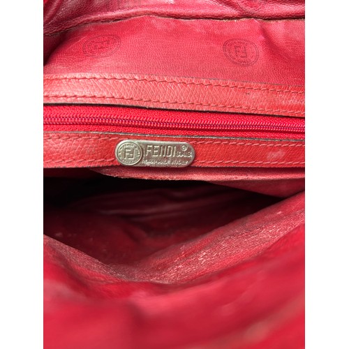 12 - A VINTAGE FENDI SIDE BAG IN BLOOD RED, interlocking 'FF' emblems throughout with a central circular ... 